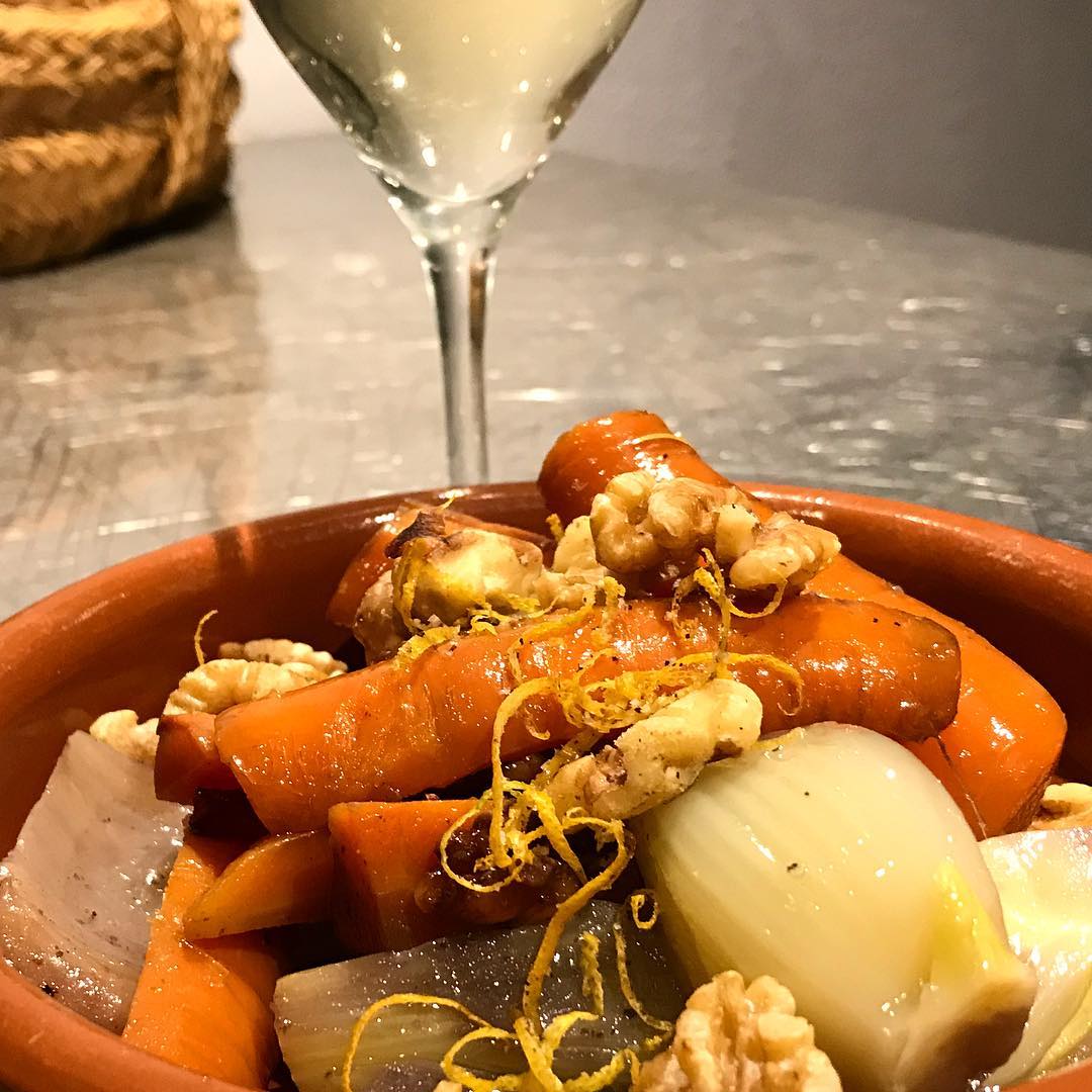 Confit of Veggies with Walnuts and Lemon Zest, paired with a glass of Villebois Sancerre. @vinoycoibiza #vinoyco #ibiza #winebar #winelovers #ibizawinter #veggie #confit #sancerre #villebois